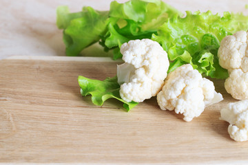 Cauliflower on a wooden background. Close-up. Copy space.