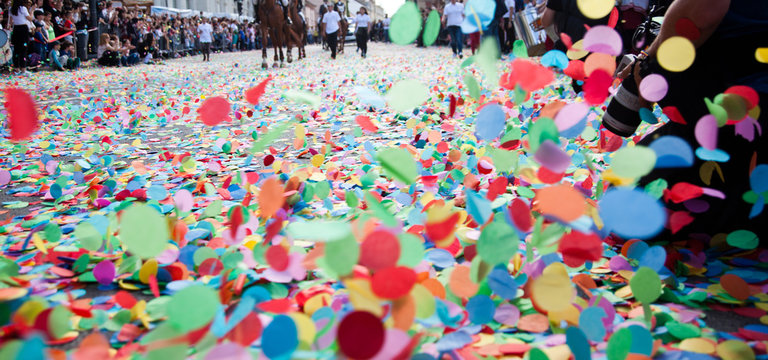 confetti on the ground during a festival or carnival in the city