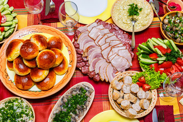 Cuts of meat and sausages on the table .