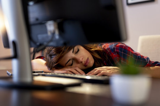 Worn Out Woman Asleep At Her Desk