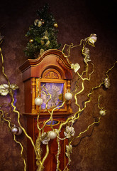 The old clock is decorated for the holiday