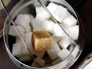 Fototapeta na wymiar Cane of cane sugar on white sugar