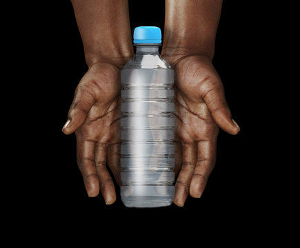 African hands with empty plastic bottle of water