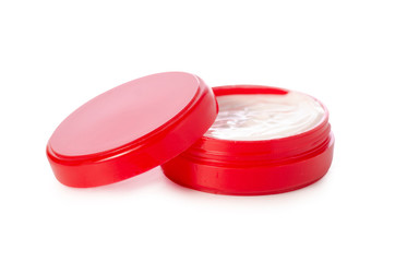 Red jar of cream human body face on a white background isolation