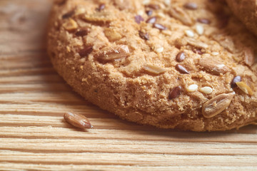 Vegan crunchy cookies with sunflower, flax seeds and sesame seeds isolated. Macro view