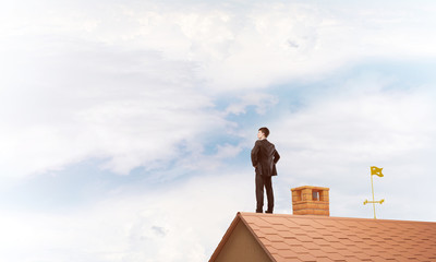 Mister boss on brick roof with arms akimbo. Mixed media