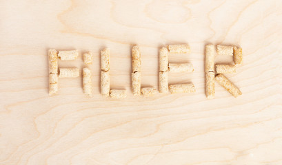 Text Filler made of filler for toilets of cats. View from above