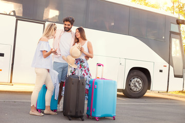 Young friends travel on vacation by bus