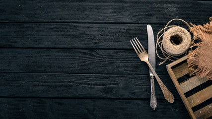 Old cutlery. On a wooden background. Top view. Copy space.