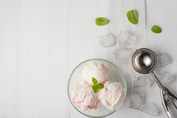 Flatlay with ice cream with jam strawberries, raspberries, cherries with mint and a spoon for ice cream. With empty space for writing