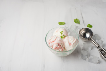 Flatlay with ice cream with jam strawberries, raspberries, cherries with mint and a spoon for ice cream. With empty space for writing