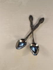 two metal teaspoons