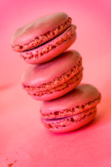 Concept sweets, enjoyment of the senses. Close up of French macaroons on a colorful background. Shallow depth of focus.