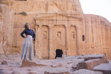 Girl in old city Petra in the desert of Wadi Musa in Jordan, a UNESCO world heritage valley