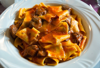 Pappardelle with boar ragu. Tuscan typical recipe.