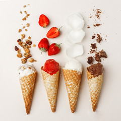 A set of ice cream in a horn with different ingredients. Isolated on white background. Procurement for Design