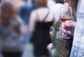 Woman holding a wine glass. copy space. Horizontal close up of Caucasian man .