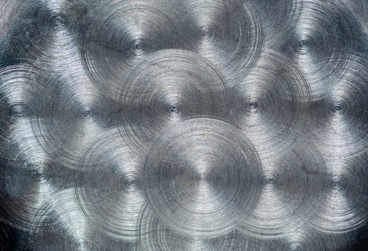 The texture of a surface of a steel sheet with a concentric pattern.