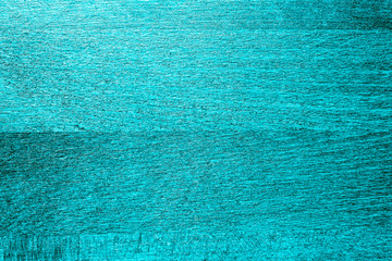 Green brilliant color close-up textured wood background.