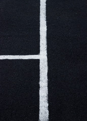 Lines on an asphalt field