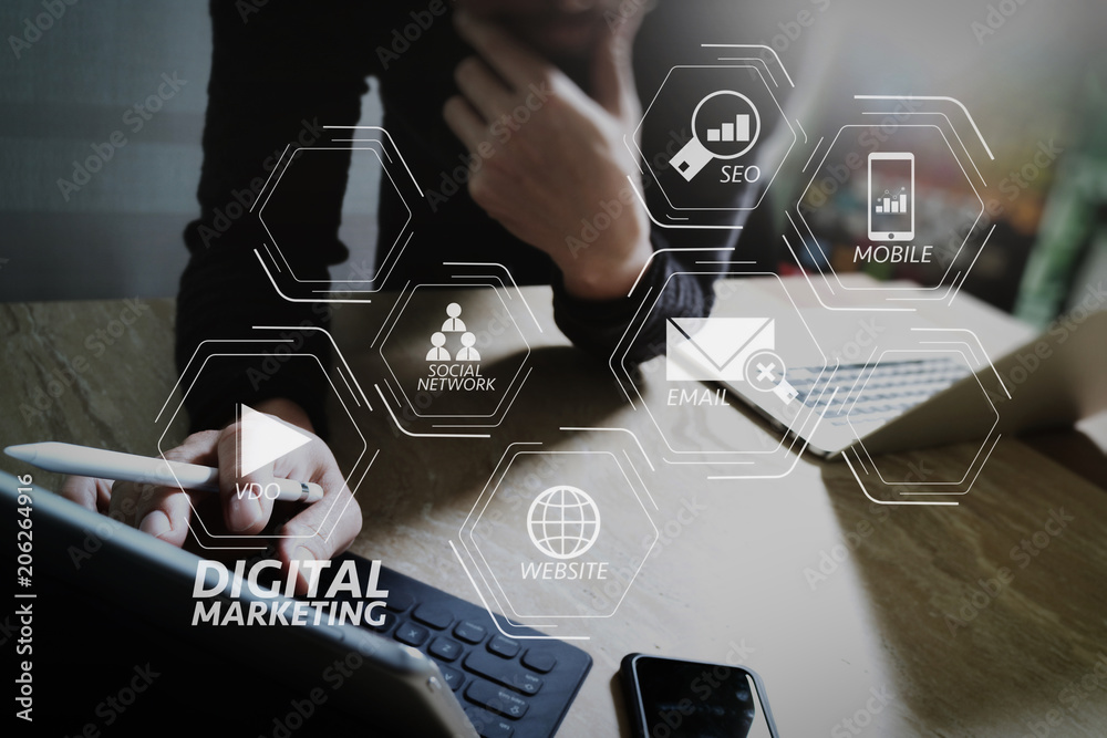 Poster Website designer working digital tablet dock keyboard and computer laptop with smart phone and graphics design diagram on mable desk as concept