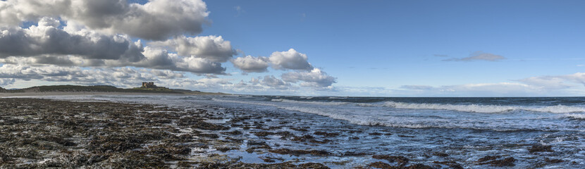 Seaside panorama with Bamburgh Castle in the back
