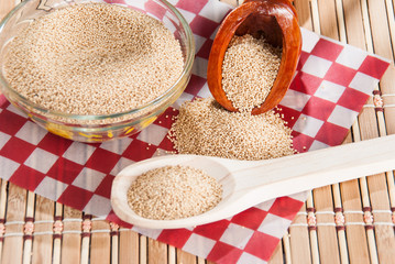 Raw Organic Amaranth grain on wooden table