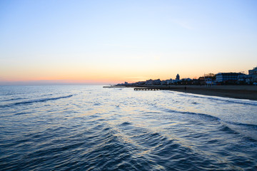 Beach at dawn, piers perspective view