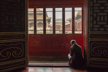 Woman reading at Forbidden city, Beijing