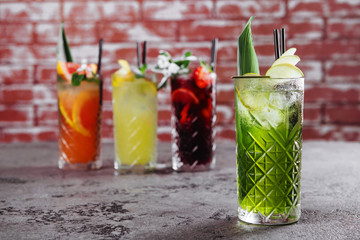 Four fruit cocktails on table.