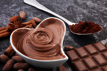 Chocolate bars on table with chocolate powder.