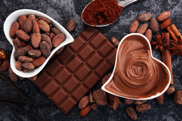 Chocolate bars on table with chocolate powder.