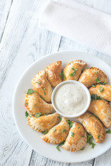 Mini chicken pies with creamy garlic sauce