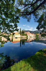 Fototapeta na wymiar View of Trebinje old town with reflection in river