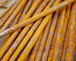 Nails with rust on a wooden table in a construction site. 