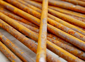Nails with rust on a wooden table in a construction site. 