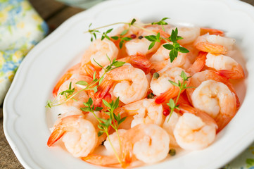 boiled shrimps on wooden surface