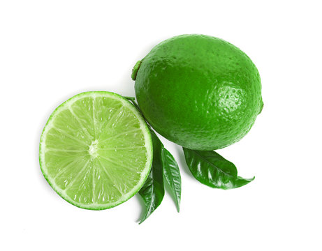 Fresh ripe green limes on white background