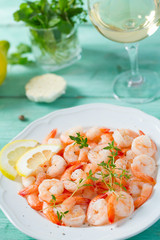 boiled shrimps on wooden surface