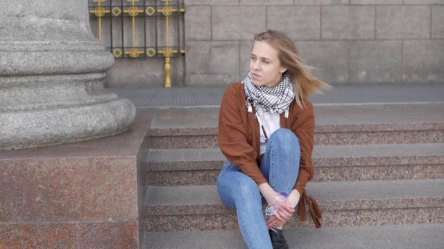 Girl sitting on the stairs