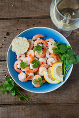 boiled shrimps on wooden surface