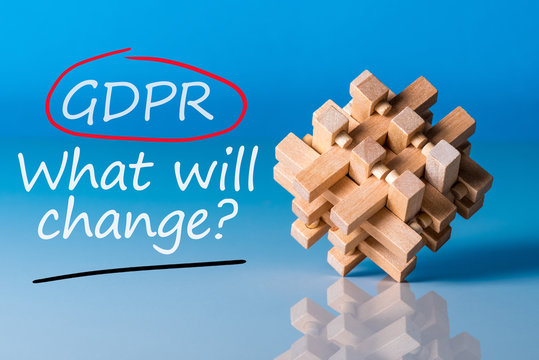 General Data Protection Regulation GDPR - What will change, Data Protection Concept. Text on blue background with wooden brain teaser