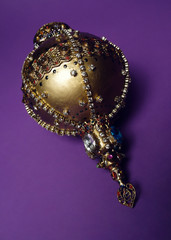Golden royal regalia and symbol of authority decorated with gems