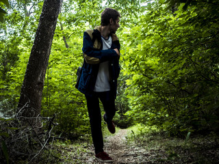 scary guy running in the dark forest