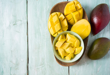 mango fruit on wooden surface