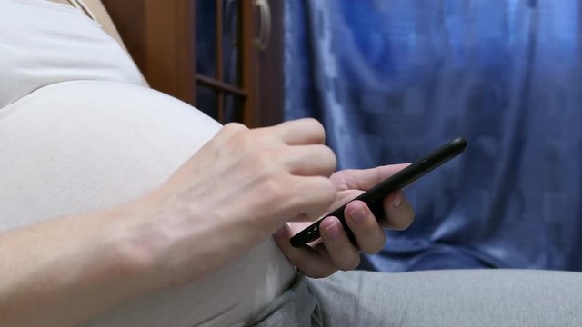 Pregnant Woman Using Mobile Phone