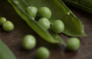 Close up of a green pea pod food photography recipe idea