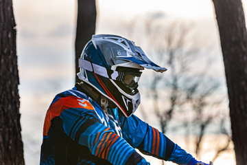 man riding a motocross in a protective suit