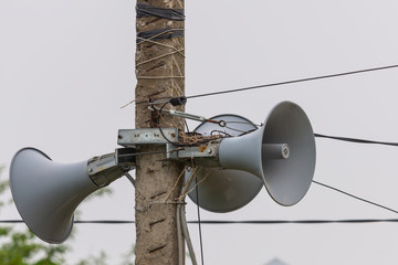 Three Loudspeaker on the street. The siren of air alarm