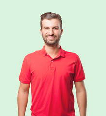 young handsome man proud pose wearing a red polo shirt . person isolated against monochrome...